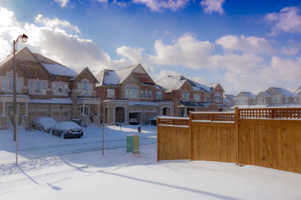 brown 2 storey houses during snow